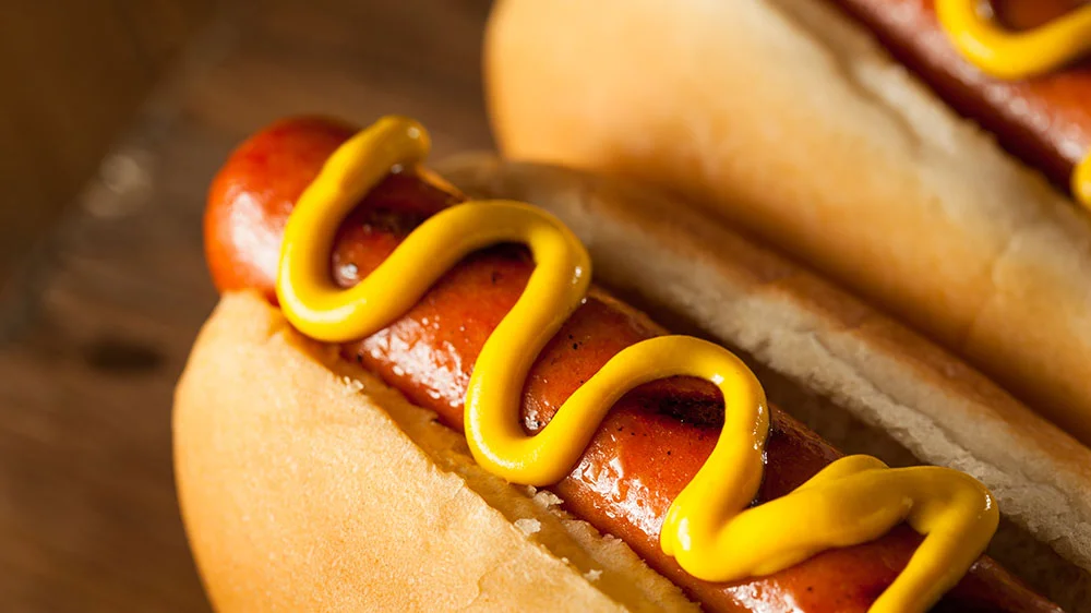 roller grill hot dog with condiments for a convenience store